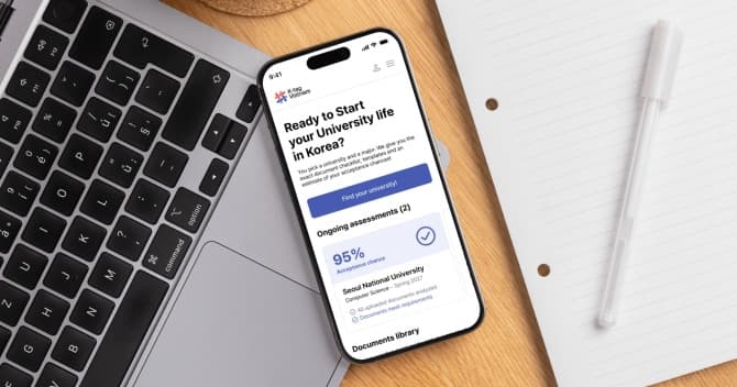 The K-tag app open on a phone beside a keyboard